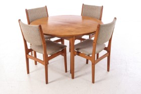 Circular dining table and four teak dining chairs, 1960s-70s (1+4)