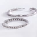 A pair of brilliant-cut diamond hoop earrings in 18 kt. white gold, 0.70 ct. (2)