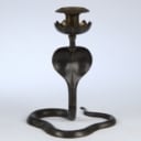 A pair of vintage cobra candlesticks in brass and enamel work (2)