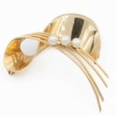 Brooch made of 14 kt gold adorned with three saltwater cultured pearls.
