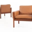 Hans J. Wegner. Pair of teak armchairs, model AP-62/1, cognac-coloured aniline leather (2)