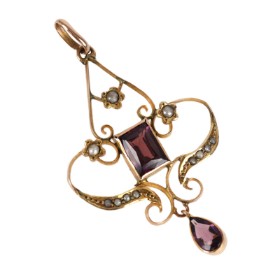 An Art Nouveau tourmaline and garnet pendant of 14k gold.