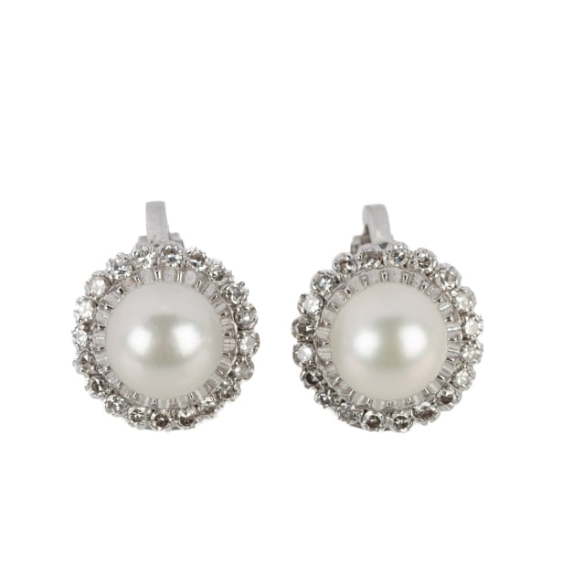Pair of cultured pearl and diamond ear clips in 18 kt white gold, approx. 0.18 ct.