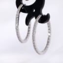 A pair of brilliant-cut diamond hoop earrings in 18 kt. white gold, 0.70 ct. (2)
