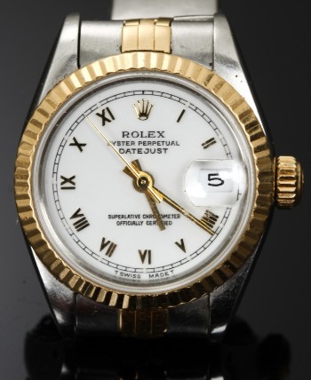 Rolex Datejust. Damenuhr aus 18 kt. Gelbgold und Stahl mit hellem Zifferblatt, ca. 1989