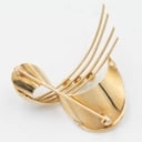 Brooch made of 14 kt gold adorned with three saltwater cultured pearls.