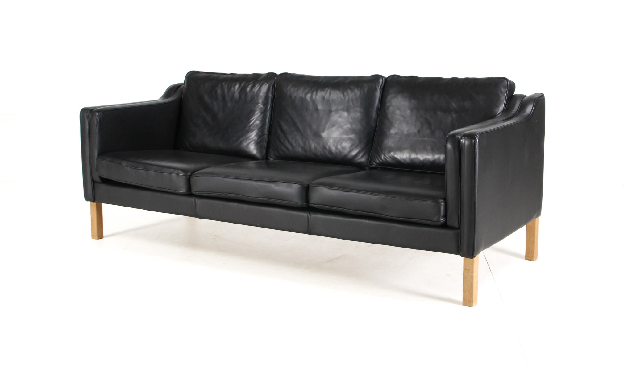 Danish furniture manufacturer. Three-seater sofa, black leather