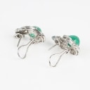 A pair of emerald and diamond ear studs of 14k white gold. 1940s. (2)