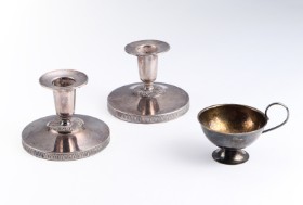 Swedish silversmiths. A pair of low candlesticks and silver punch cups (3)