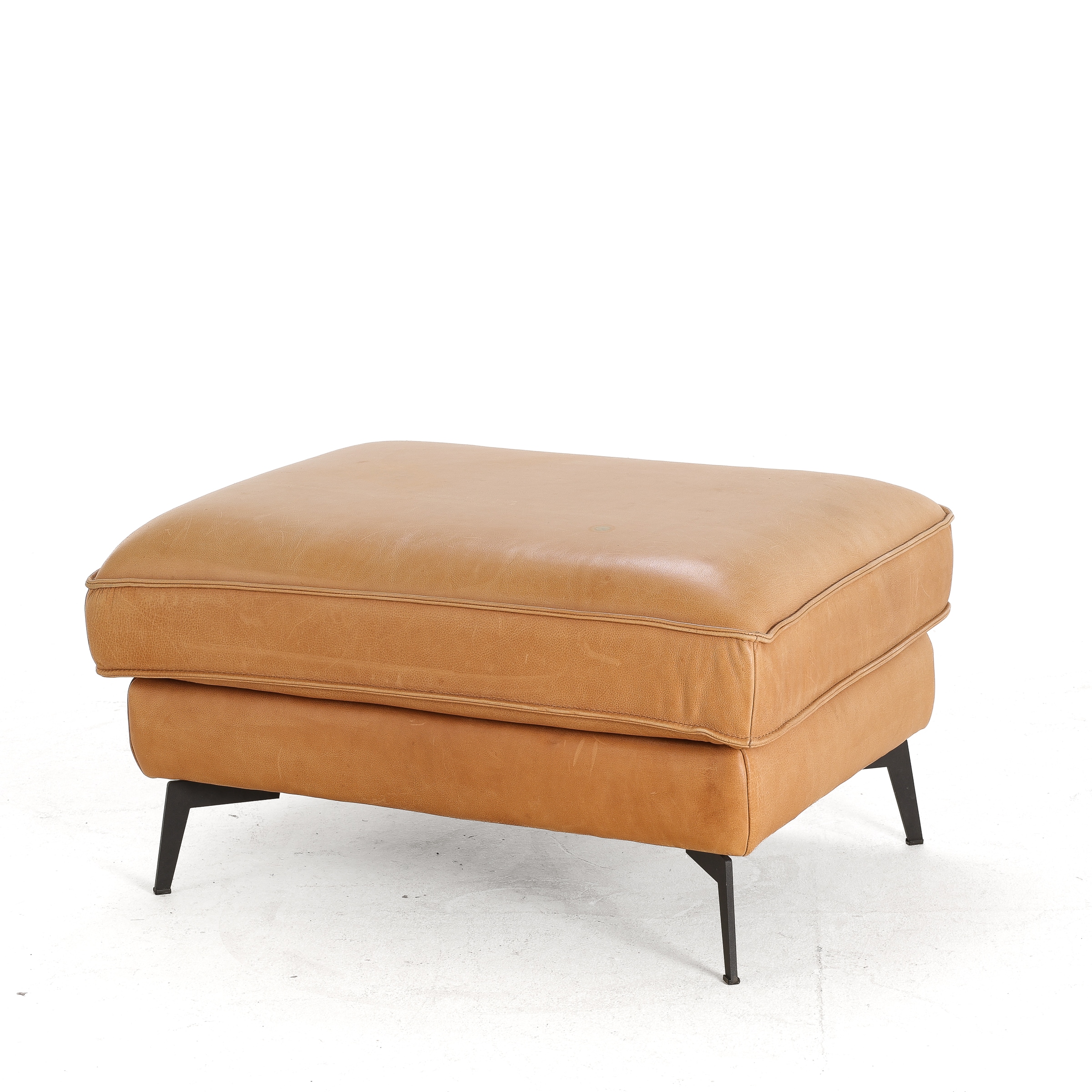 Danish furniture manufacturer circa 2020: Rectangular pouf made of light patinated leather.