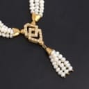 Italian three-row freshwater pearl necklace with diamond pendant and 18 kt. gold clasp