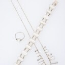 Volmer Bahner: Jewelry set with white enamel. (3)