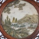 Chinese two-sided porcelain painting mounted in a carved wooden frame on a foot