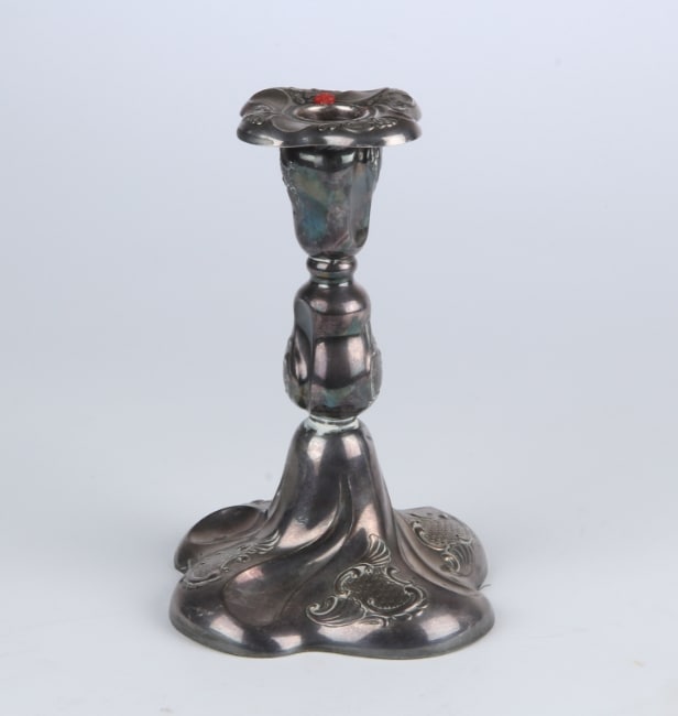 A pair of Empire style candlesticks, a silver candlestick, a glass candlestick (4)