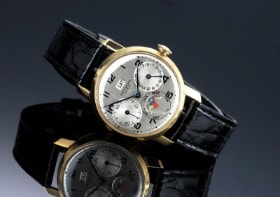 Universal 'Triple-Date Moonphase'. Vintage herreur i 18 kt. guld med sølvfarvet skive, ca. 1949