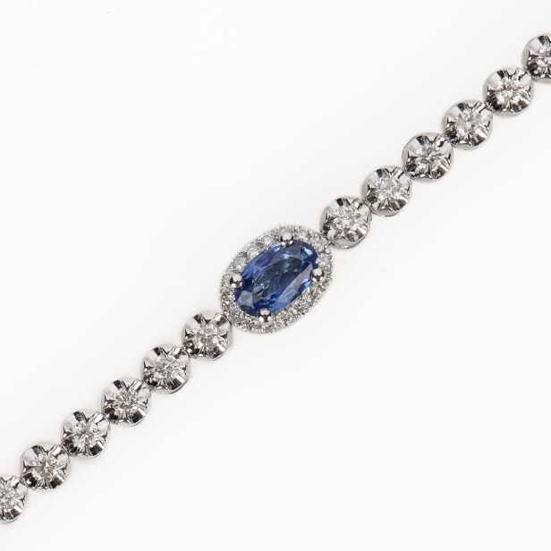 Diamond and sapphire tennis bracelet in 18 kt white gold