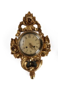 Swedish cartel clock of gilded wood and gesso, approx. 1900