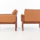 Hans J. Wegner. Pair of teak armchairs, model AP-62/1, cognac-coloured aniline leather (2)