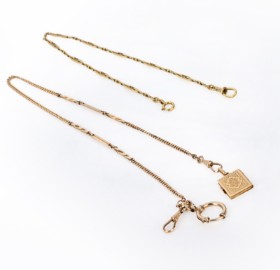 Two pocket watch chains of gold-plated metal with pendants of 18 kt. gold (3)