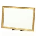 Mirror in a frame of gold-bronzed wood and gesso. 70 x 113 cm.