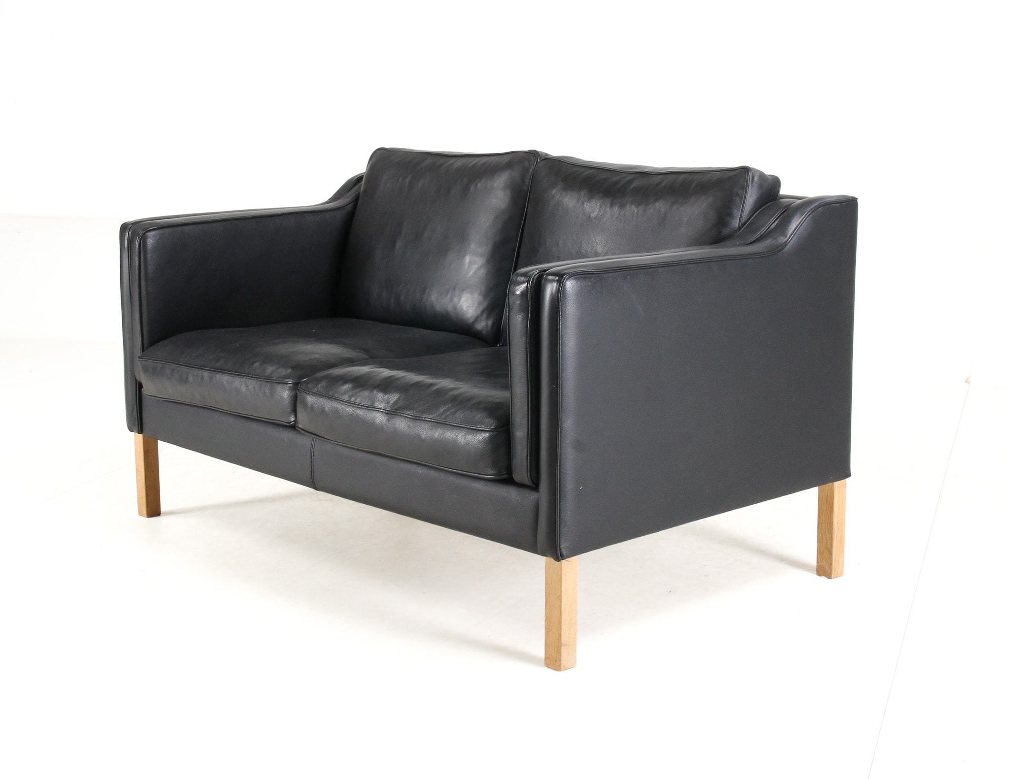 Danish furniture manufacturer. Two-seater sofa, black leather