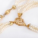 Italian three-row freshwater pearl necklace with diamond pendant and 18 kt. gold clasp