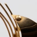Brooch made of 14 kt gold adorned with three saltwater cultured pearls.