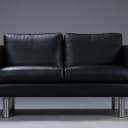 Stouby. Two-person sofa, model Boston, black leather.