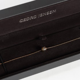 Georg Jensen. Nina Koppel. 'Fusion' bracelet of 18 kt. gold w/ 8 diamonds in GJ box.