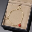 Marianne Dulong. Armbånd med charms, 18 kt. guld
