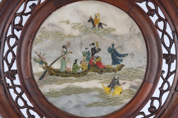 Chinese two-sided porcelain painting mounted in a carved wooden frame on a foot