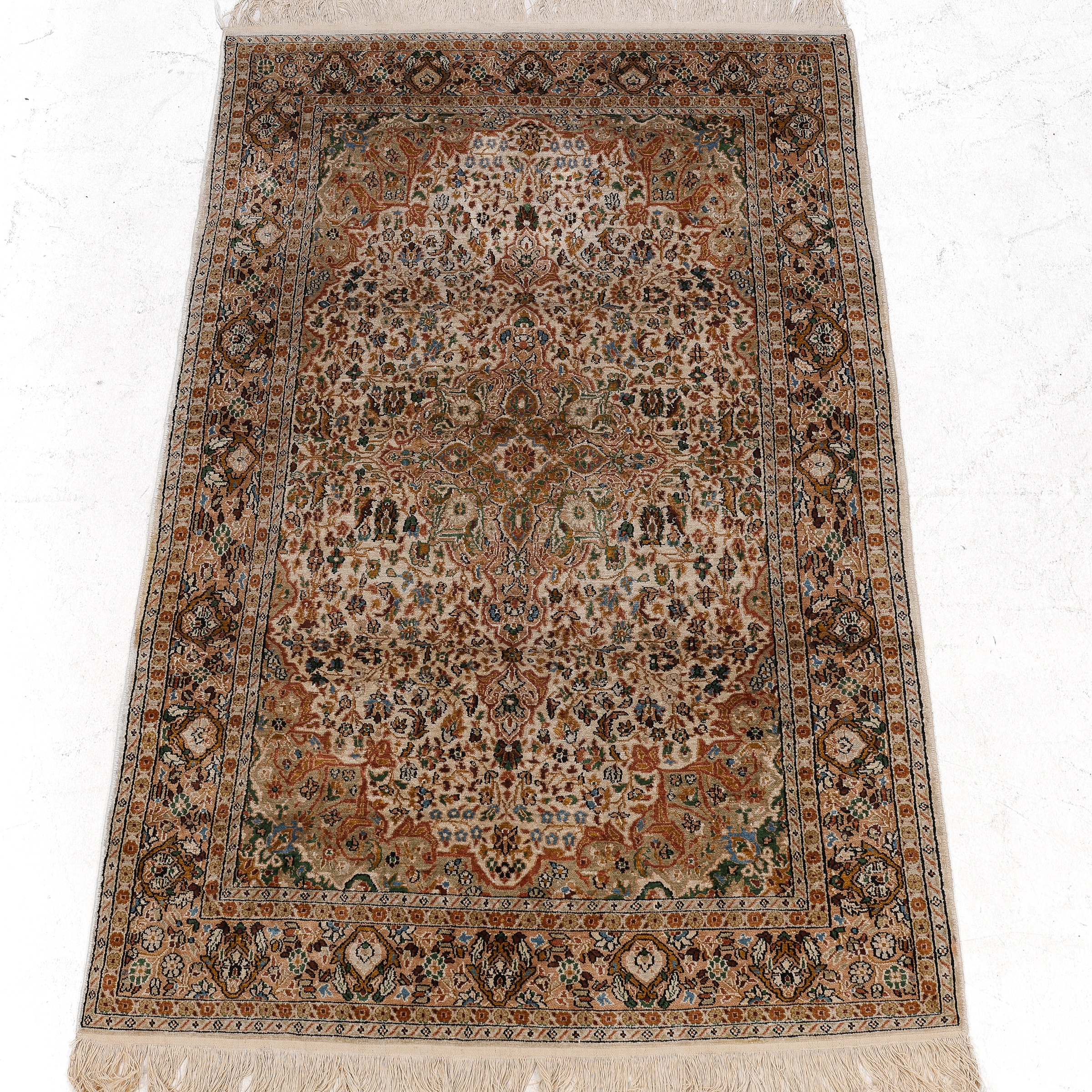 Persian carpet: Classic pattern in silk and wool.