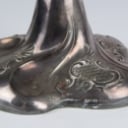 A pair of Empire style candlesticks, a silver candlestick, a glass candlestick (4)
