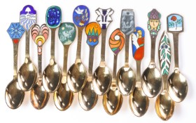 A. Michelsen. A collection of Christmas spoons in gilt sterling silver with enamel (14)