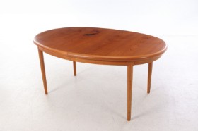 Oval teak dining table with extension