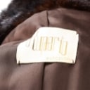 Long coat made of dark brown mink, approx. size L.