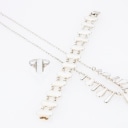 Volmer Bahner: Jewelry set with white enamel. (3)