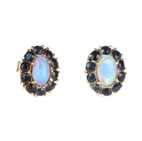 A pair of opal and sapphire studs of 14k gold. (2)