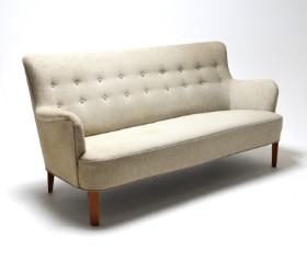 Danish furniture manufacturer: Sofa with wool cover and buttons in the back