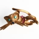 Brooch: Cat with gemstone, 18 kt. gold