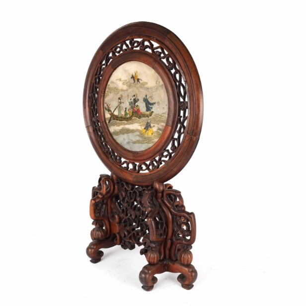 Chinese two-sided porcelain painting mounted in a carved wooden frame on a foot