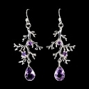 Earrings in rhodium-plated Sterling silver adorned with numerous amethysts.