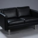 Stouby. Two-person sofa, model Boston, black leather.