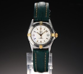 Breitling 'Callistino'. Ladies' watch in 18 kt. gold and steel with original strap and buckle, 1990s