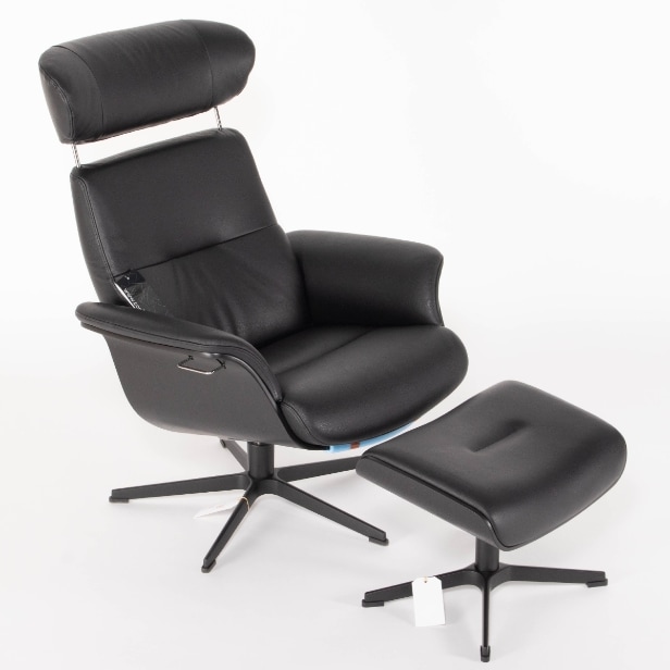 551. Conform. Armchair with stool in black leather (2)