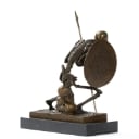 Bronze sculpture, fighting skeleton warrior.