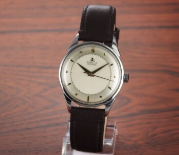 Gübelin IpsoMatic. Vintage herreur i stål med two-tone skive, 1950erne