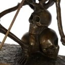 Bronze sculpture, fighting skeleton warrior.