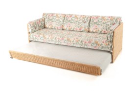 Sofa bed with rattan frame.