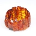 An amber bracelet on elastic. Weight 102.5 g.